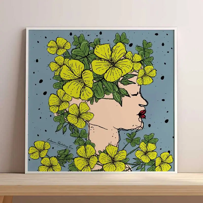 Framed artwork of a woman's profile with yellow flowers and green leaves on a blue background. Lebanese flowers poster, Lebanese poster